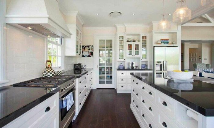 white cabinets with black countertops