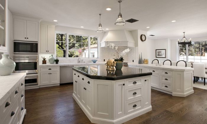 white cabinets with black countertops