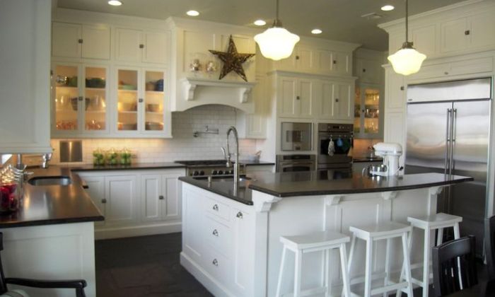 white cabinets with black countertops