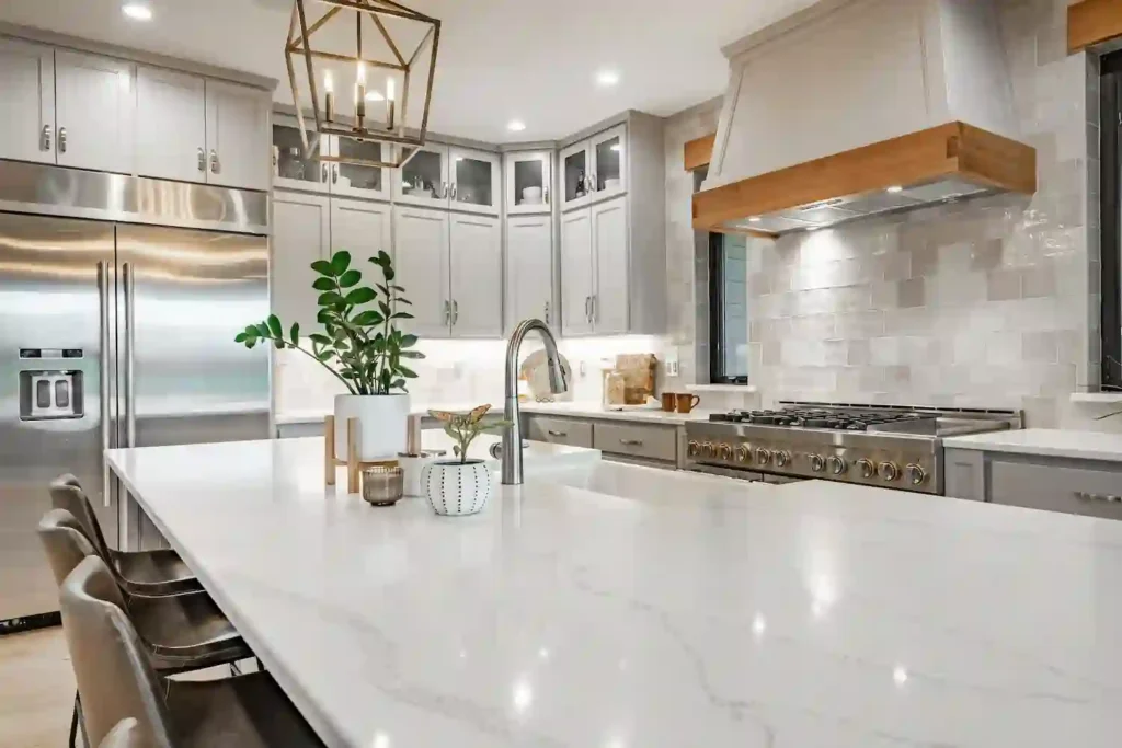 Modern kitchen with white quartz countertop, highlighting Quartz Countertop Cost in 2026