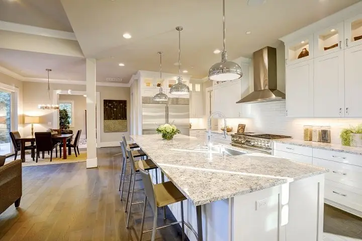 How much do granite countertops cost for a large kitchen island with sink and polished white granite surface.