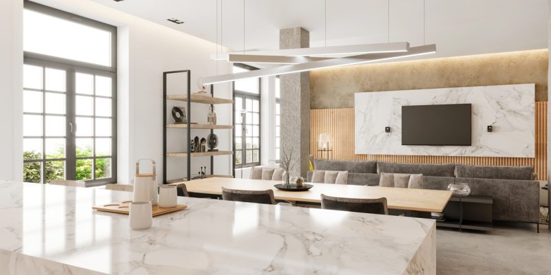 Modern open plan apartment kitchen and dining room interior. Marble countertop, wooden dining table, chairs, pillars, shelf, windows, wooden wall, pendant lamp and TV set in the background. Copy space template. Render.
